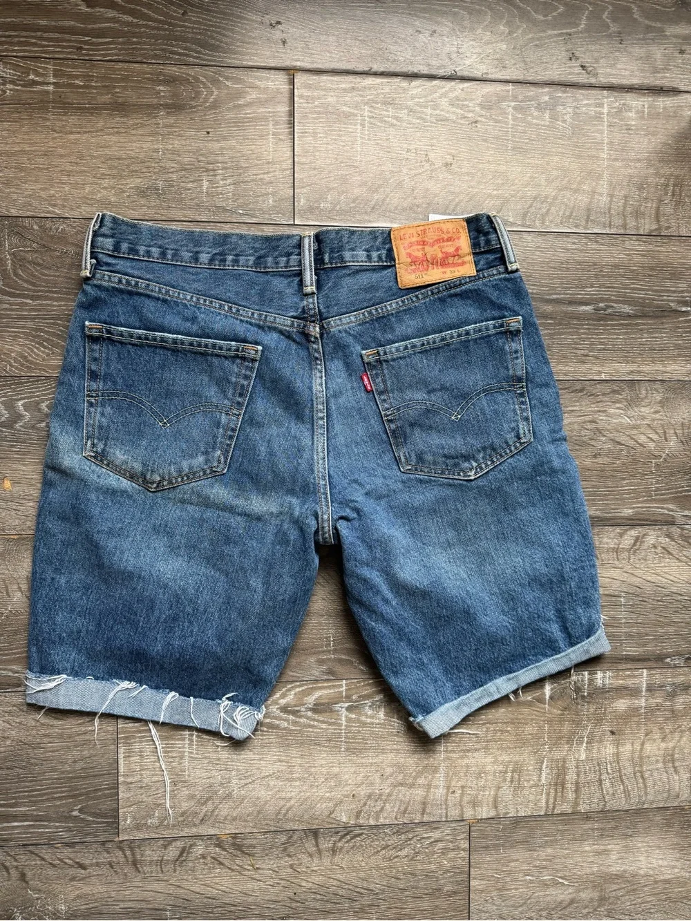 Levi's Distressed Medium Blue Denim Cutoff Jean Shorts